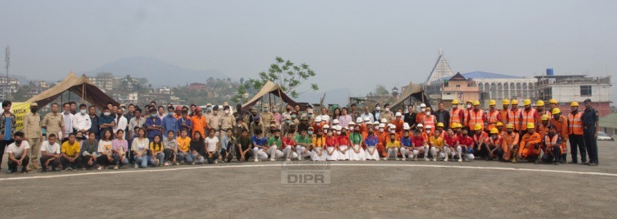 Participants and officials during the district level mock exercise simulating an earthquake and fire incident conducted at Mon Hq on March 19. (DIPR Photo)